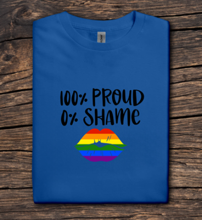 Blue t-shirt with '100% Proud 0% Shame' text and rainbow design on a wooden surface