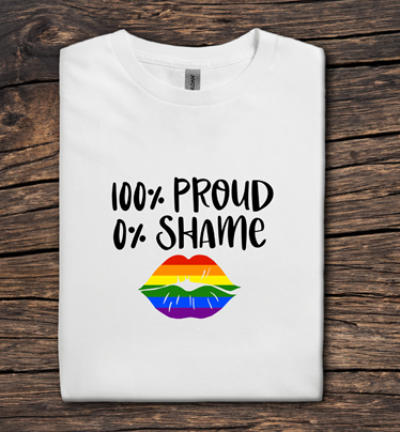 White t-shirt with '100% Proud 0% Shame' text and rainbow lips design on a wooden background