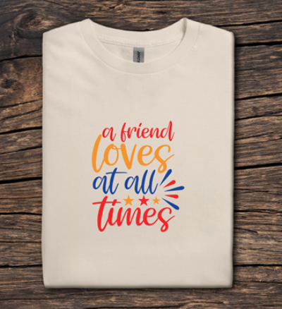 Beige t-shirt with colorful text on a wooden surface