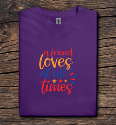 Purple t-shirt with colorful text on a wooden surface