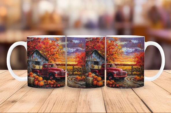 Ceramic coffee mug featuring an autumn farmhouse scene with a red vintage truck, pumpkins, rustic barn, and colorful fall foliage.