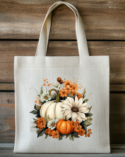 Tote bag with autumn design featuring pumpkins and flowers on a wooden background