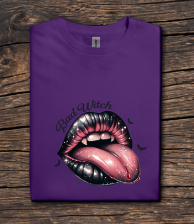 Purple t-shirt with a graphic of lips and 'Bad Witch' text on a wooden surface