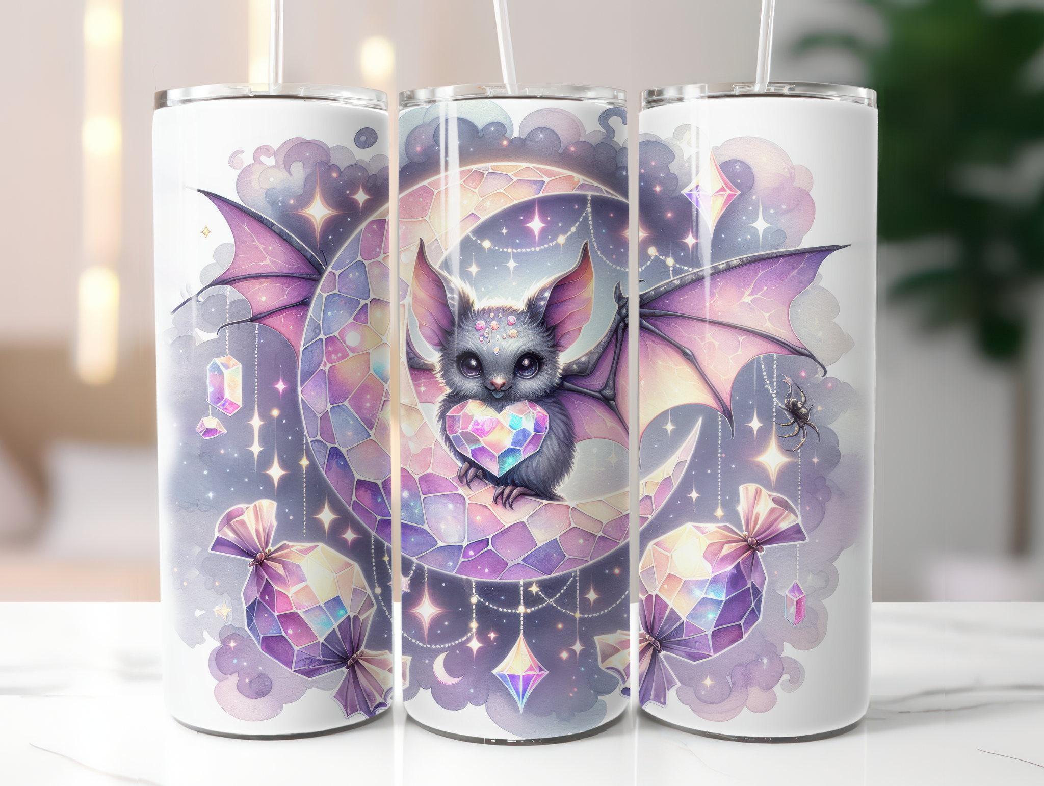 Three tumbler cups with a cute bat design on a white surface.