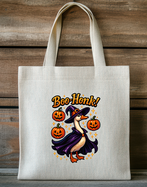 Boo Honk Halloween tote bag featuring a witch goose surrounded by pumpkins on a reusable fabric tote.
