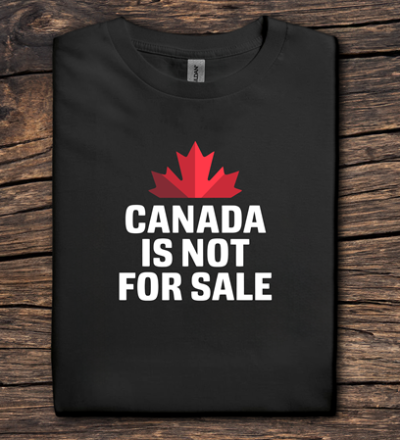 Black t-shirt with red maple leaf and 'Canada is not for sale' text on a wooden surface