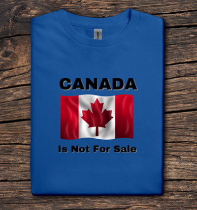 Blue t-shirt with Canadian flag and 'Canada is Not For Sale' text on a wooden surface