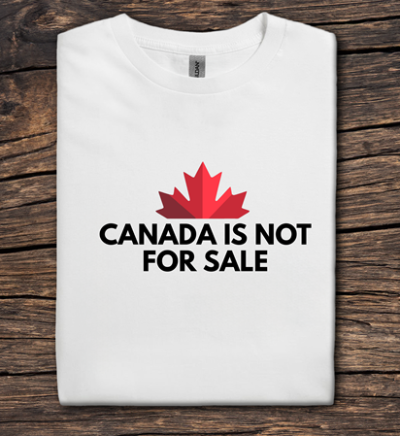White t-shirt with red maple leaf and 'Canada is not for sale' text on a wooden surface