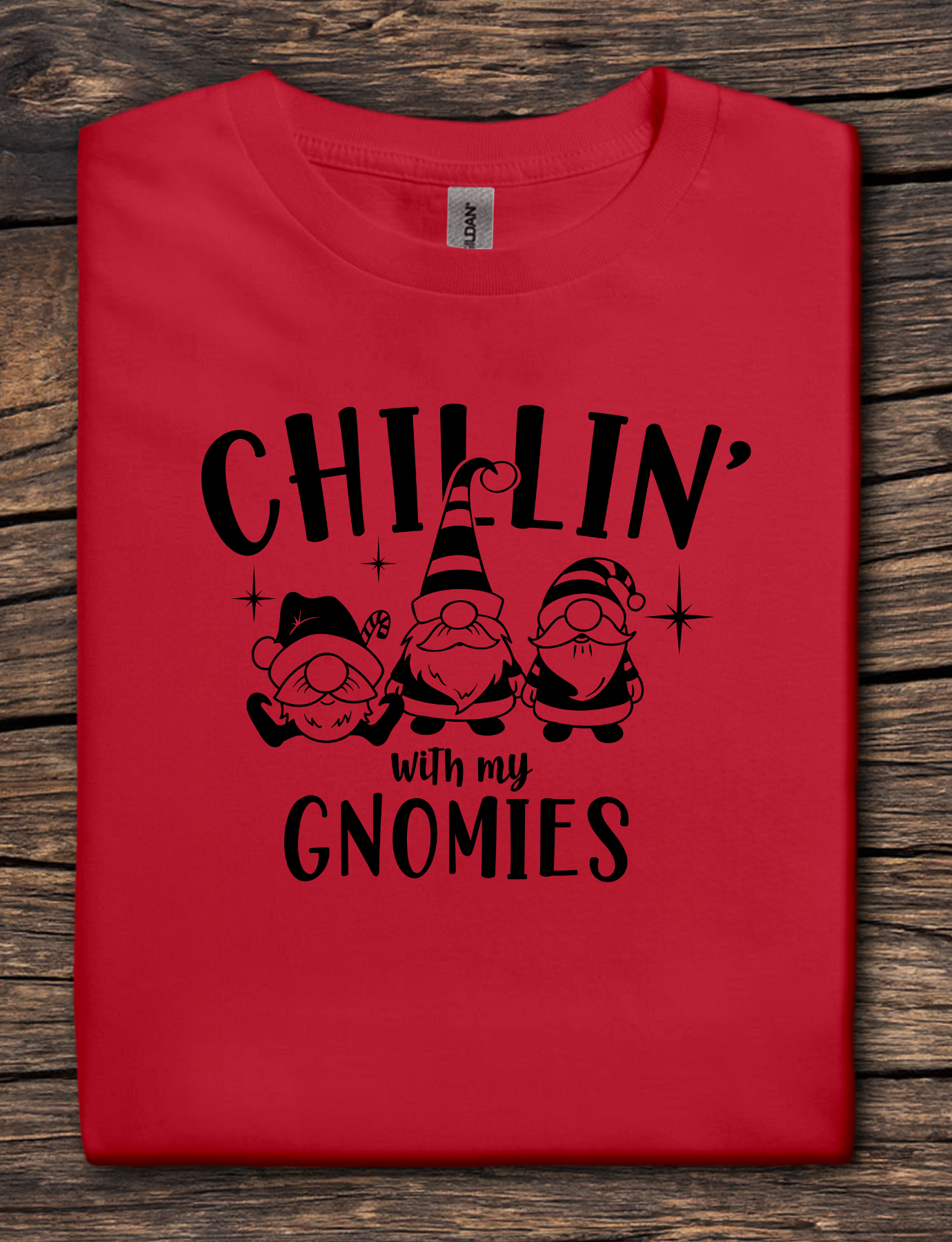 Red t-shirt with black graphic text reading “Chillin’ With My Gnomies” and three winter gnome illustrations.