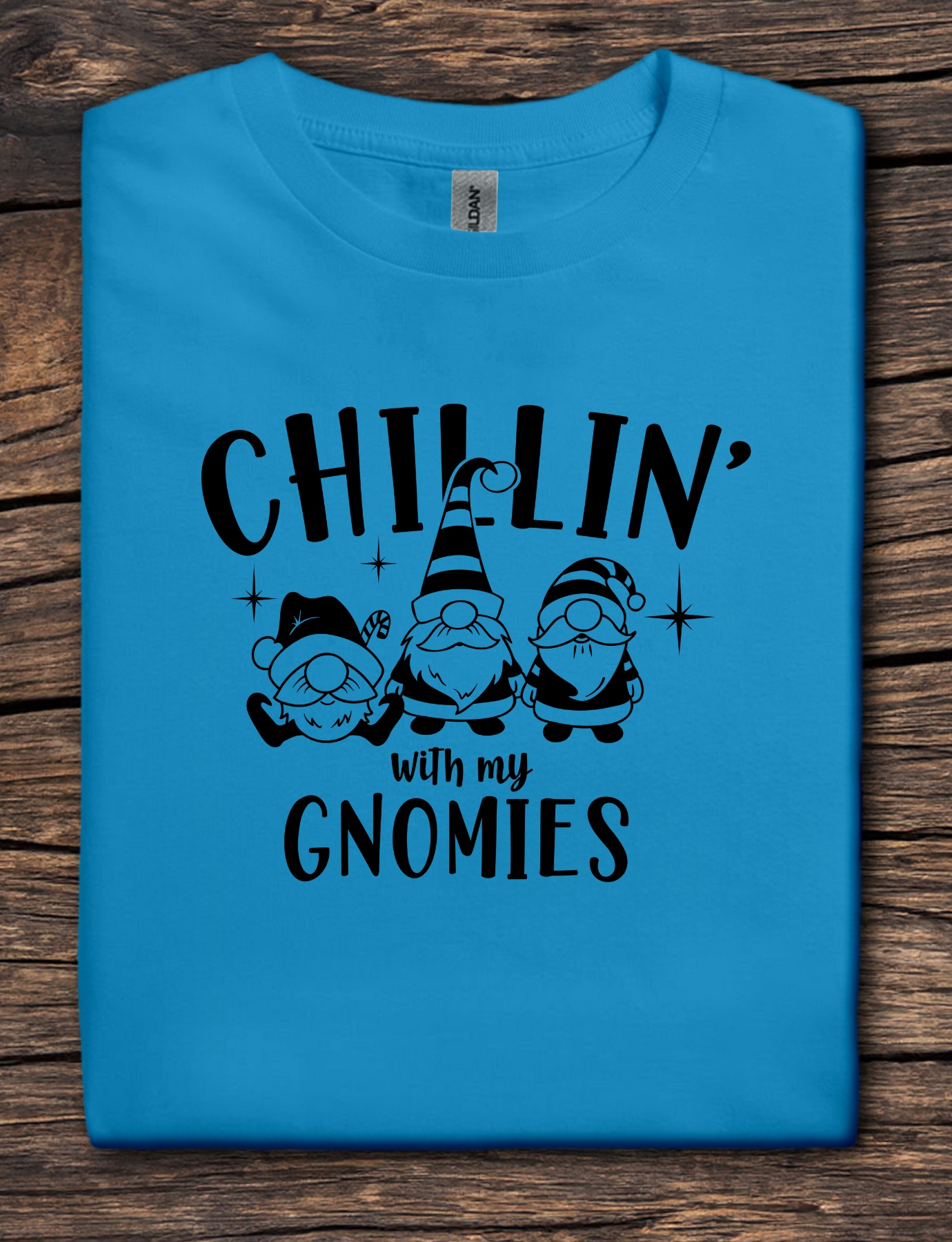 Sapphire t-shirt with black graphic text reading “Chillin’ With My Gnomies” and three winter gnome illustrations.