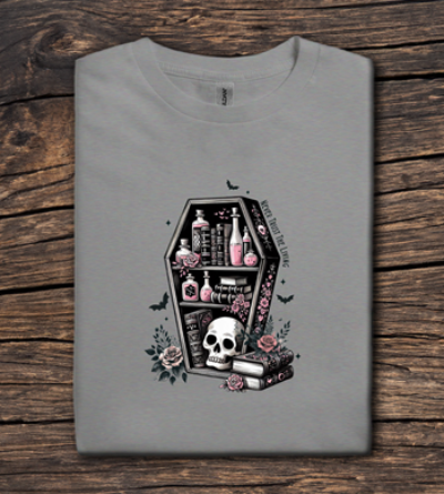 Gray t-shirt with a coffin design featuring a skull and various items on a wooden surface