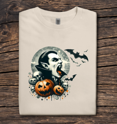 Beige t-shirt with Halloween-themed design featuring a man, pumpkins, and bats on a wooden surface.