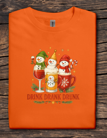 Orange Christmas t-shirt with three snowmen holding festive drinks and the phrase Drink Drank Drunk.