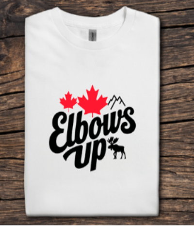 White t-shirt with 'Elbows Up' and maple leaf design on a wooden surface