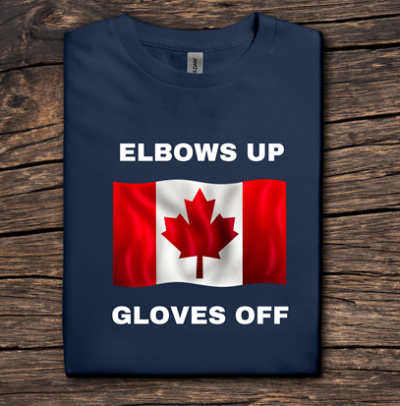 Navy blue t-shirt with Canadian flag and text 'ELBOWS UP GLOVES OFF' on a wooden surface