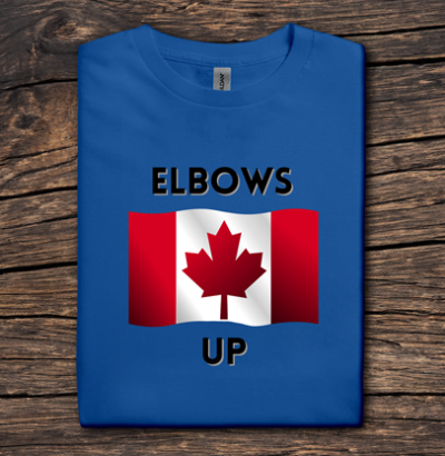 Blue t-shirt with Canadian flag and 'ELBOWS UP' text on a wooden surface