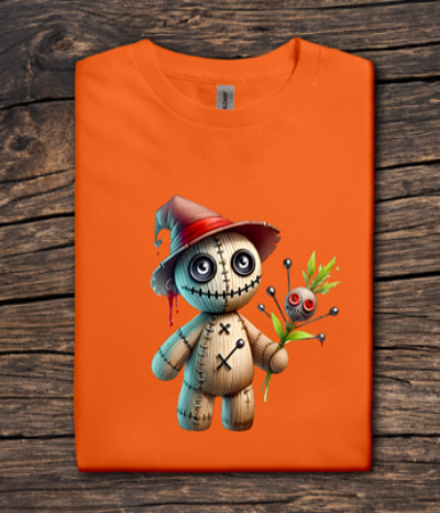 Orange t-shirt with a cartoon character design on a wooden surface