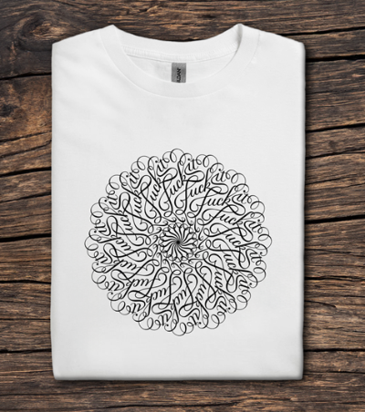 White t-shirt with black circular design on a wooden surface