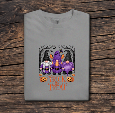 Gray t-shirt with Halloween-themed gnomes design on a wooden surface