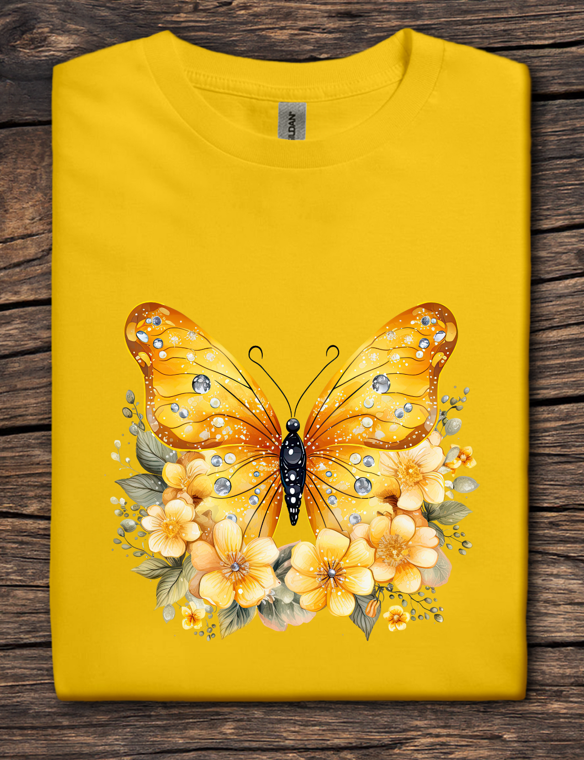 Yellow t-shirt with a golden yellow butterfly surrounded by yellow flowers and jeweled details.