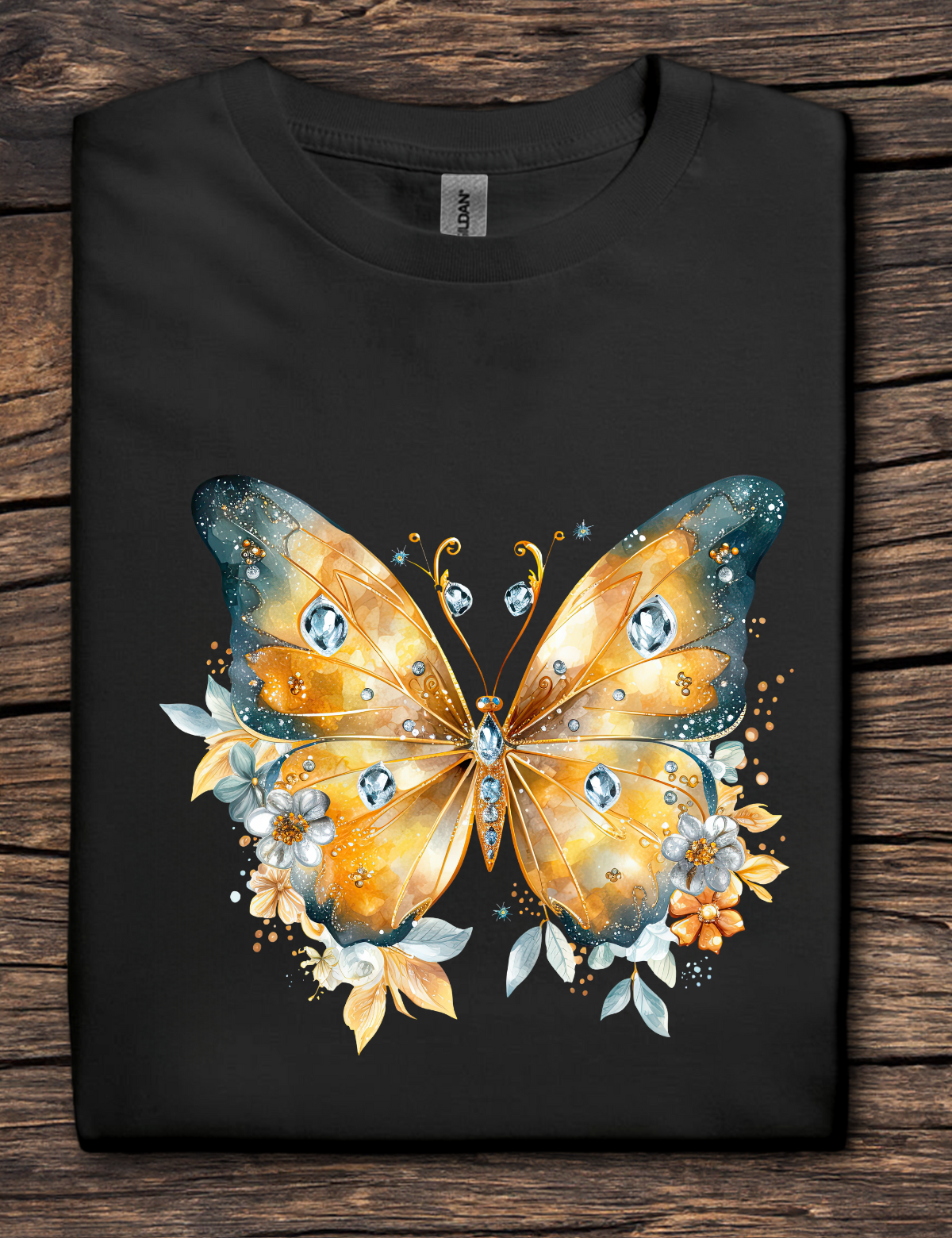 Black t-shirt with a colorful butterfly design on a wooden surface