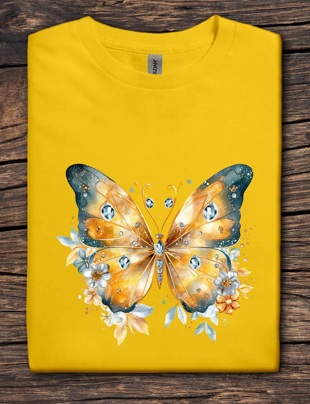 Yellow t-shirt with a butterfly design on a wooden surface