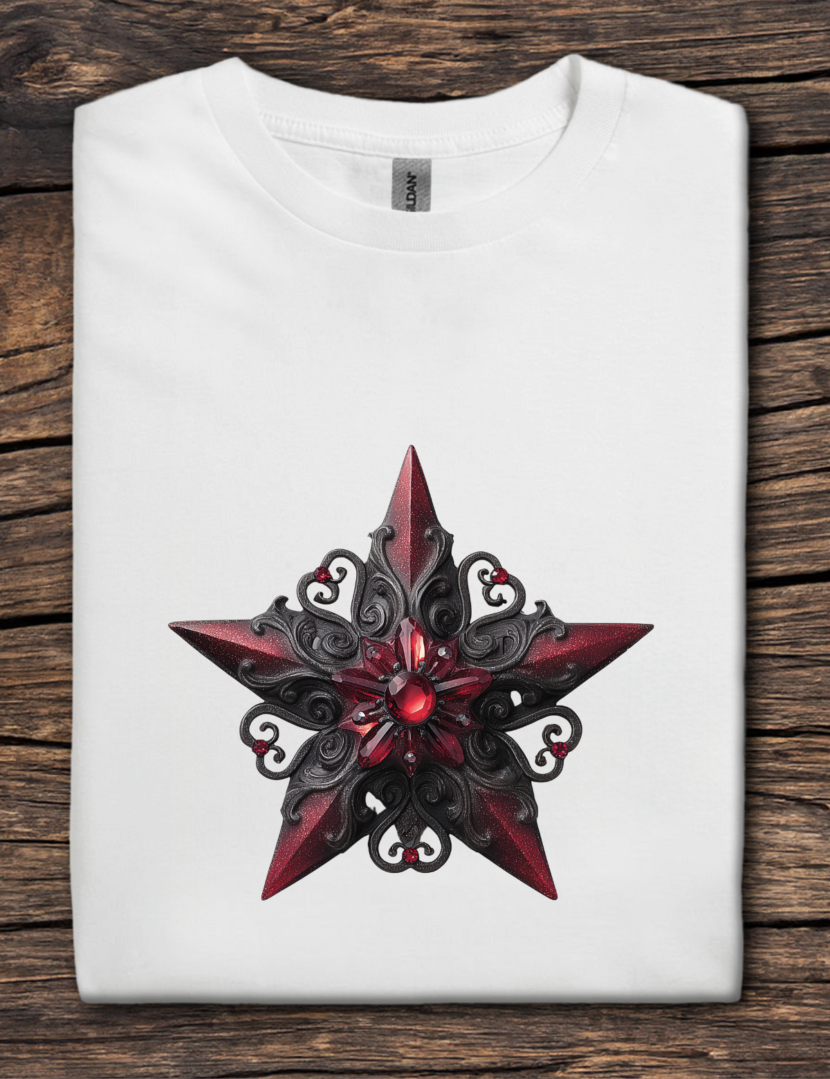 White t-shirt with a red and black star design on a wooden surface