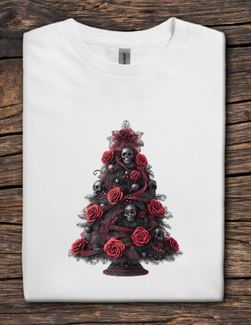 White t-shirt with a black Christmas tree design featuring red roses and skulls on a wooden surface.
