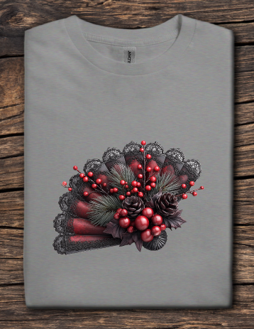 Gray t-shirt with a decorative design of red berries, green leaves, and black lace on a wooden surface.