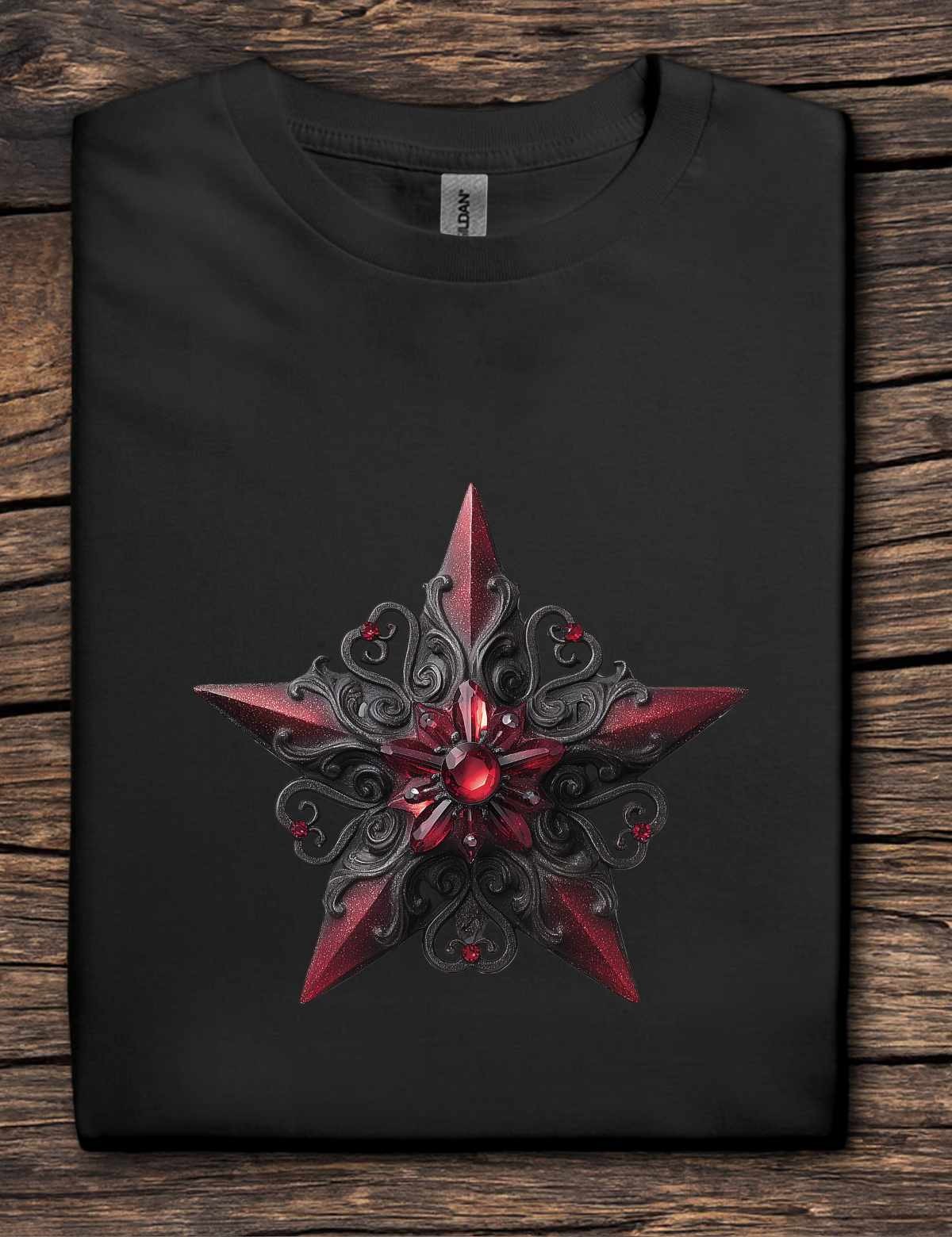 Black t-shirt with a red and black star design on a wooden surface