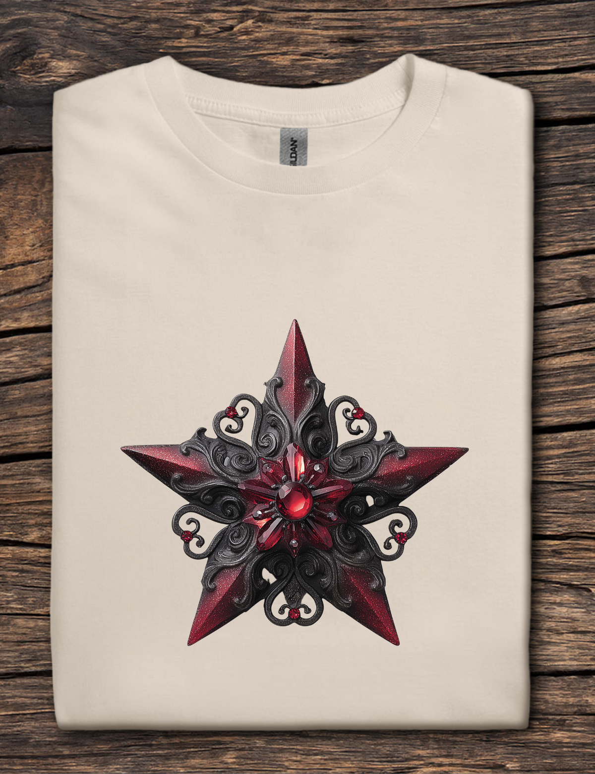 Beige t-shirt with a red and black star design on a wooden surface