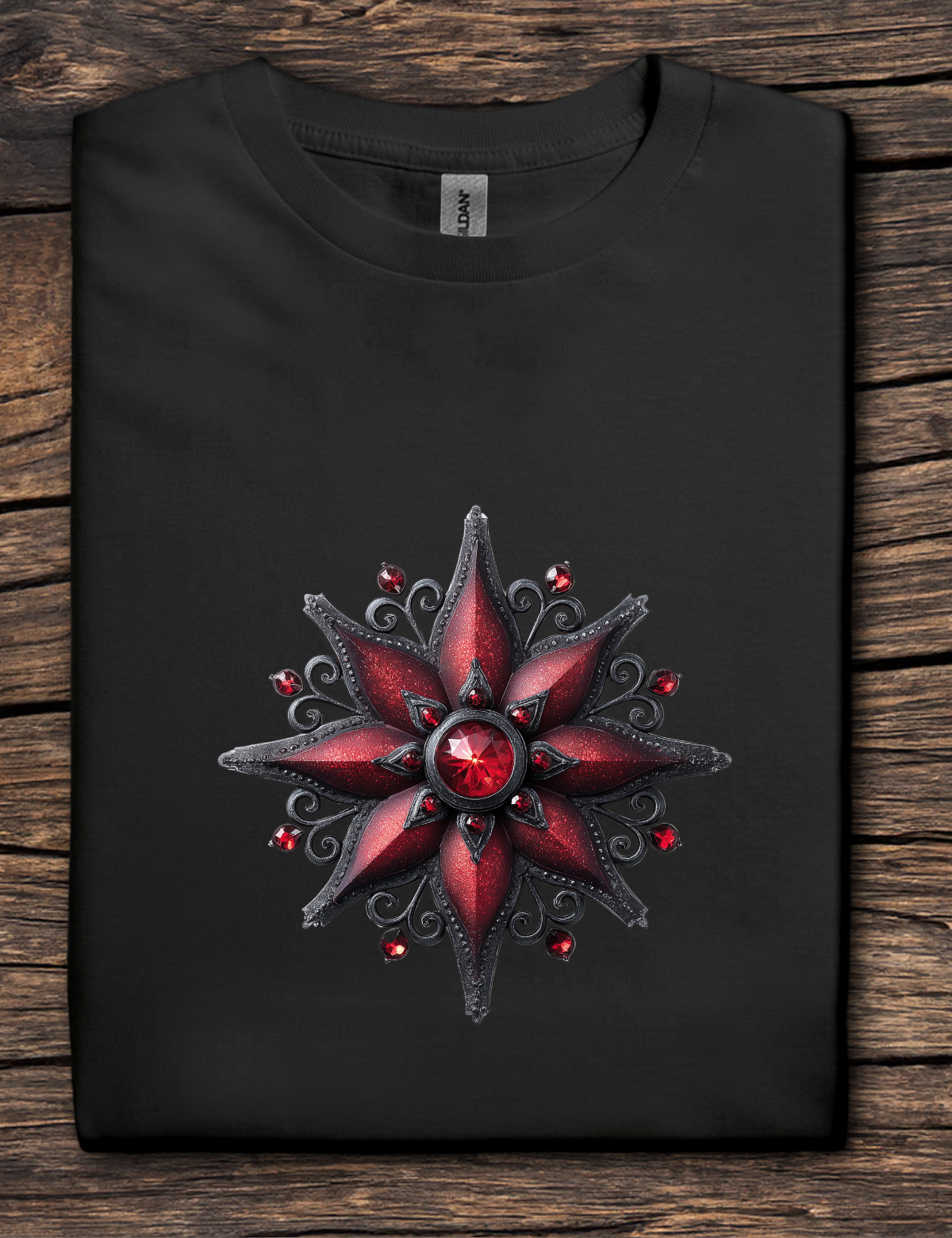 Black t-shirt with a red and silver star design on a wooden surface