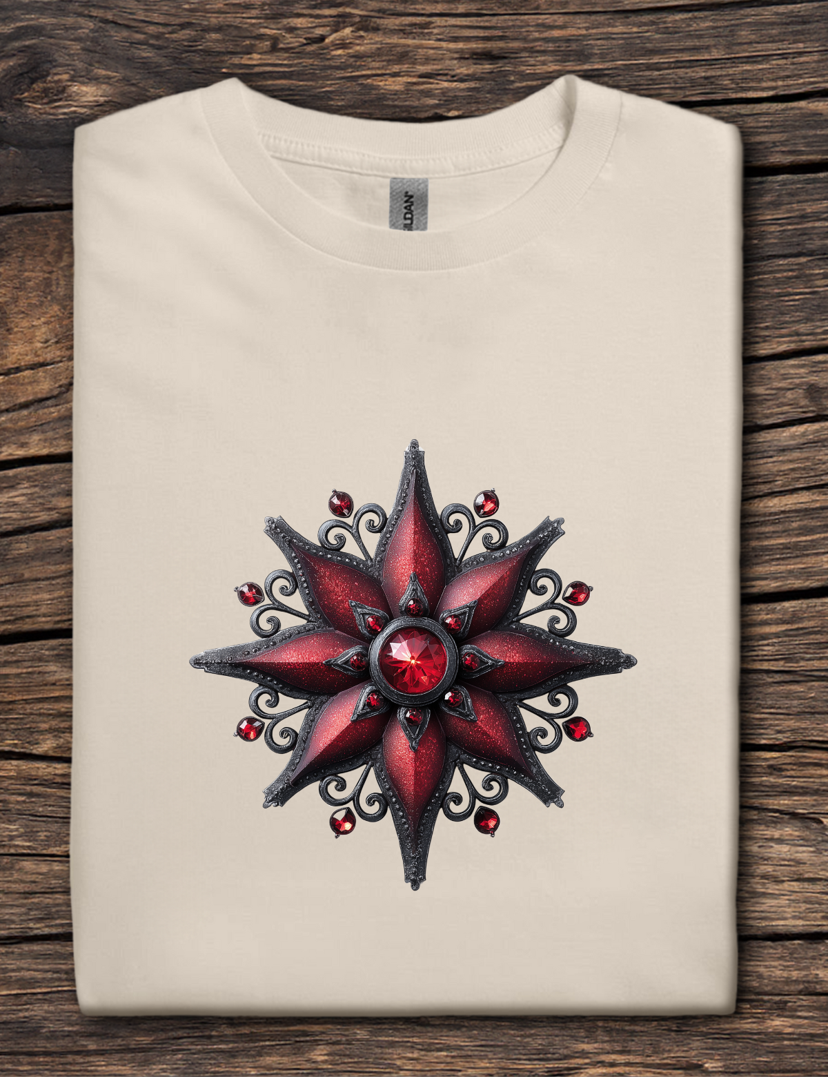 Beige t-shirt with a red and black star design on a wooden surface