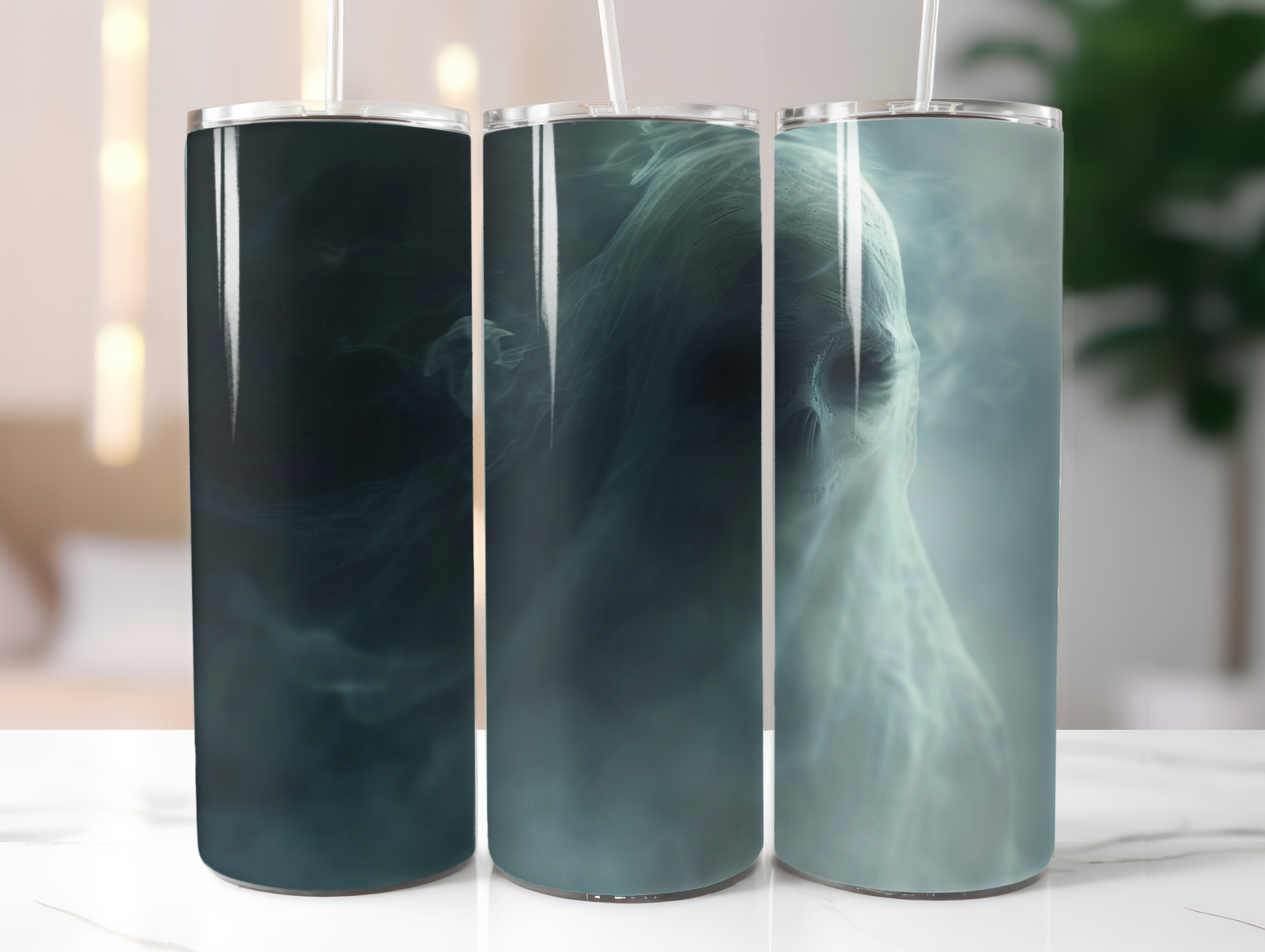 Three cylindrical tumblers with marble-like designs on a white surface.