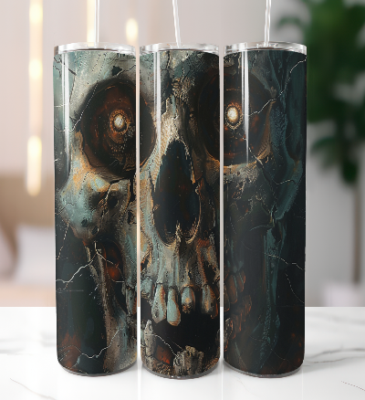 Three cylindrical tumblers with skull design on a white surface.