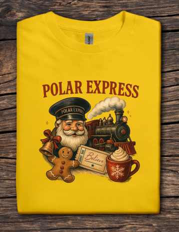 Yellow t-shirt with 'Polar Express' design featuring Santa Claus, train, and holiday elements on a wooden surface.