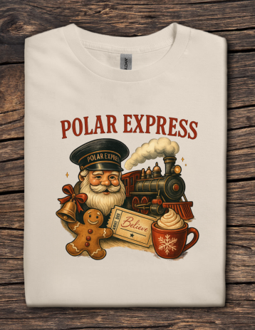 T-shirt with 'Polar Express' design featuring Santa Claus, train, and holiday elements on a wooden surface.
