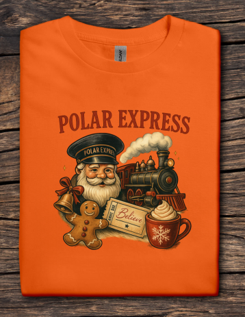 Orange t-shirt with 'Polar Express' design featuring Santa Claus, a train, and festive elements on a wooden surface.