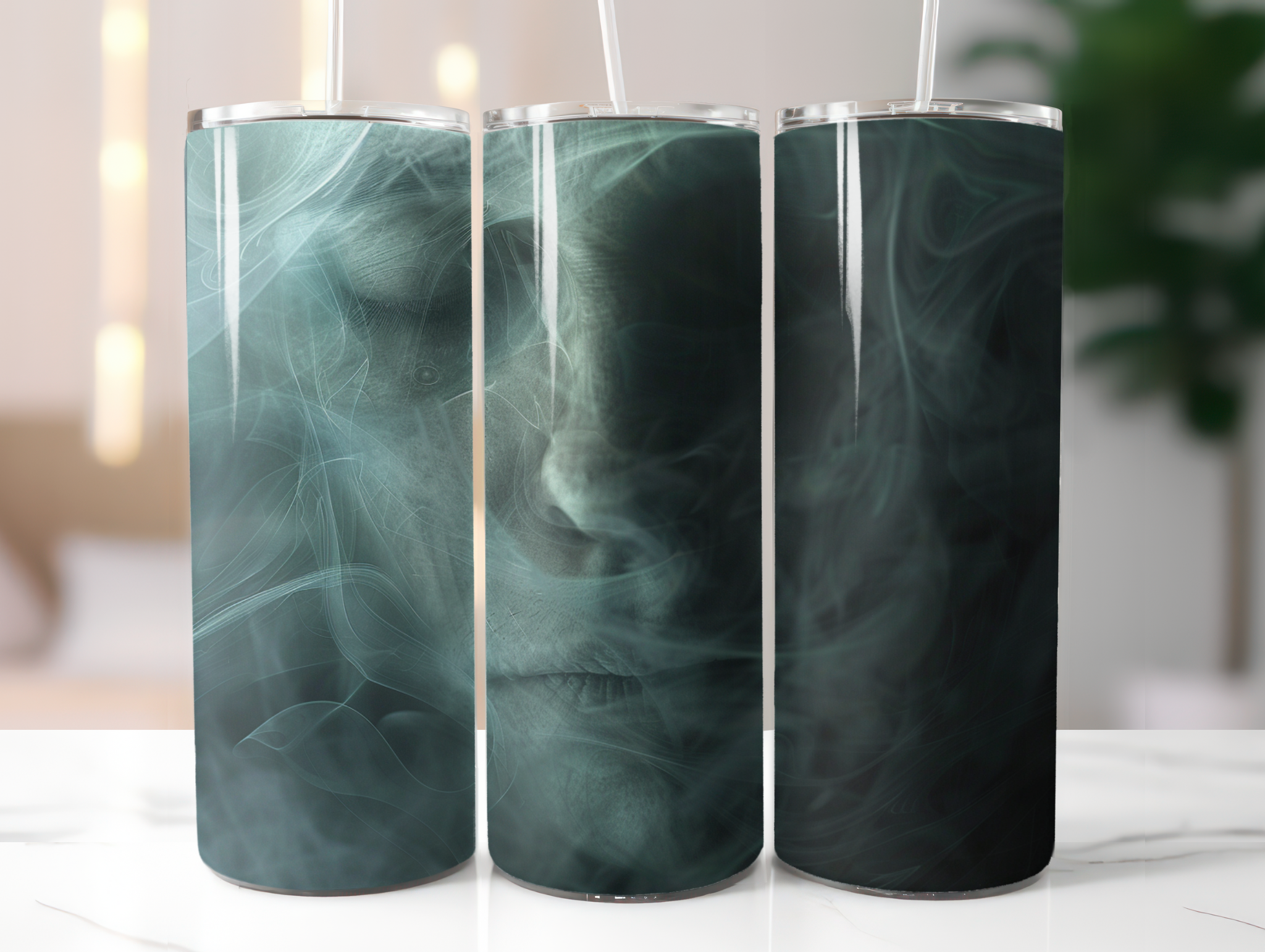 Three cylindrical tumblers with a green marble pattern on a white surface.