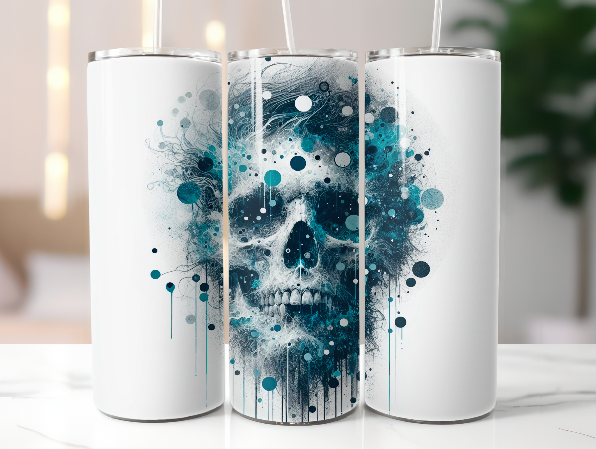 Three white tumblers with skull and abstract design on a white surface.