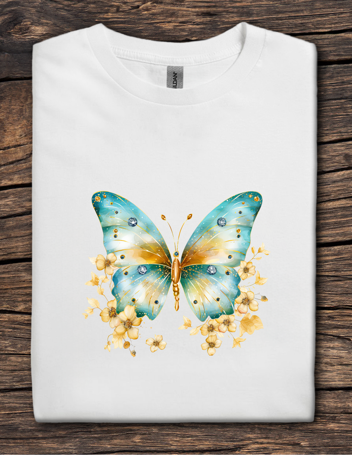 White t-shirt with a blue and yellow butterfly design on a wooden surface