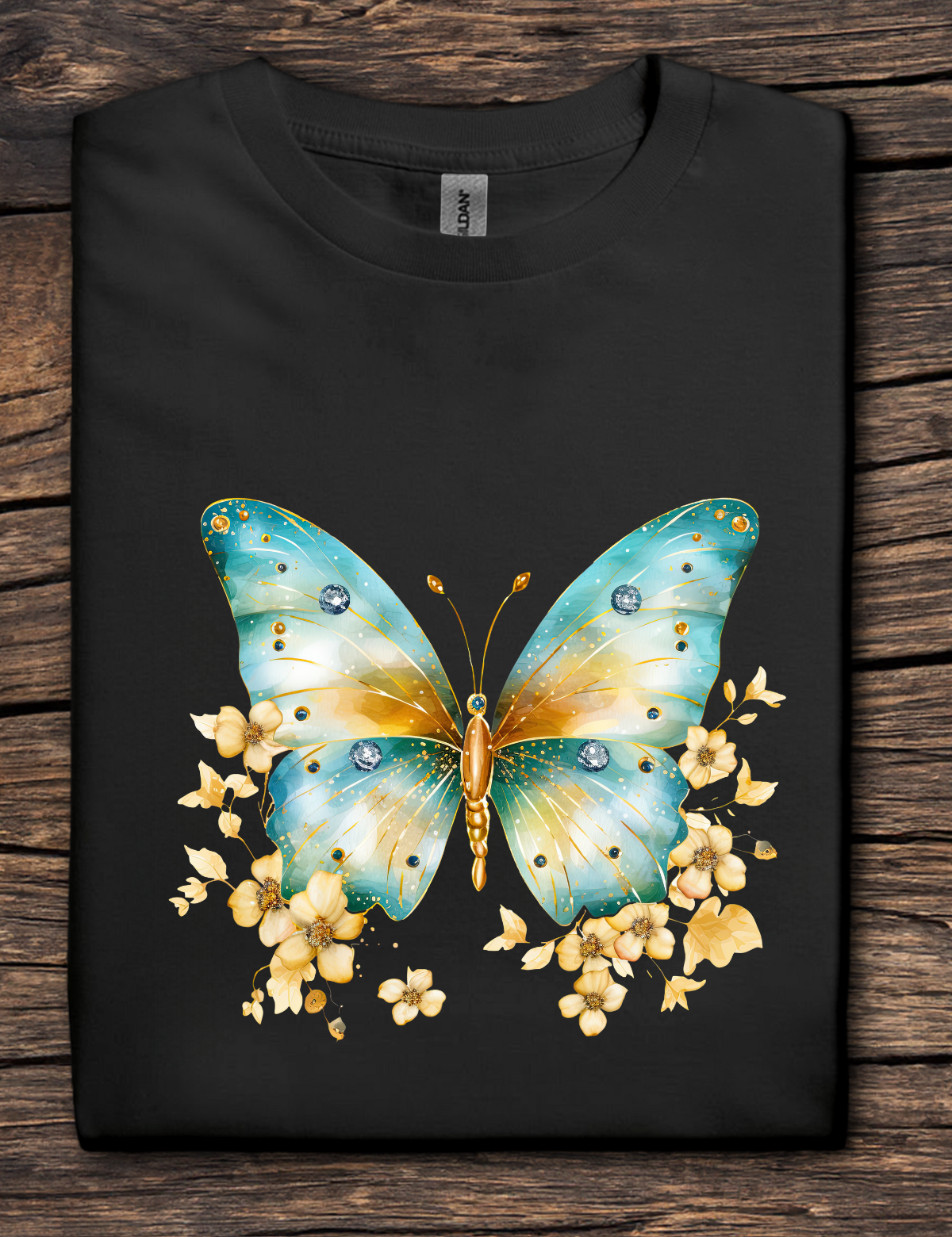 Black t-shirt with a blue and yellow butterfly design on a wooden surface