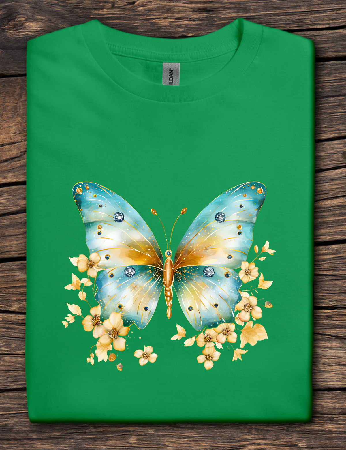 Green t-shirt with a colorful butterfly design on a wooden surface