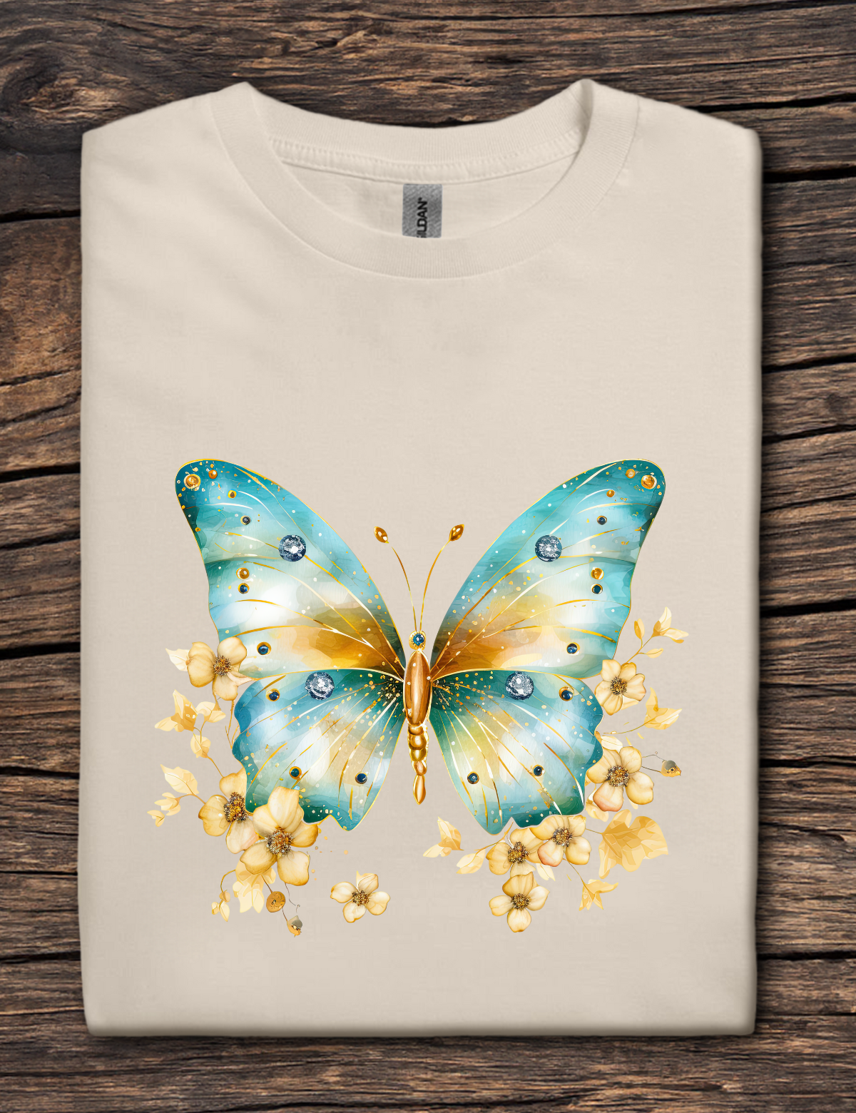 Beige t-shirt with a colorful butterfly design on a wooden surface